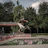 A happy young man with his BMX bike in a skate park.