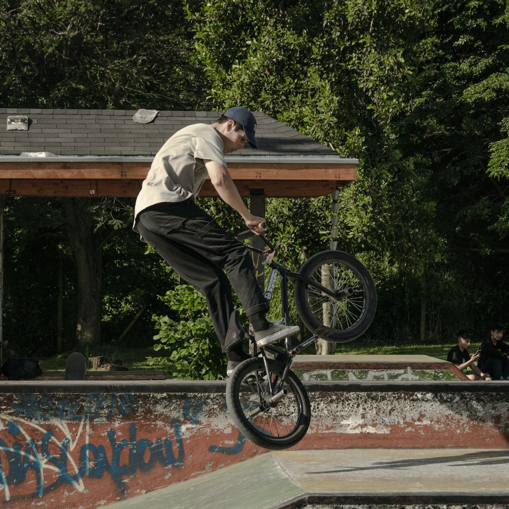 a man doing a wheelie on a bike