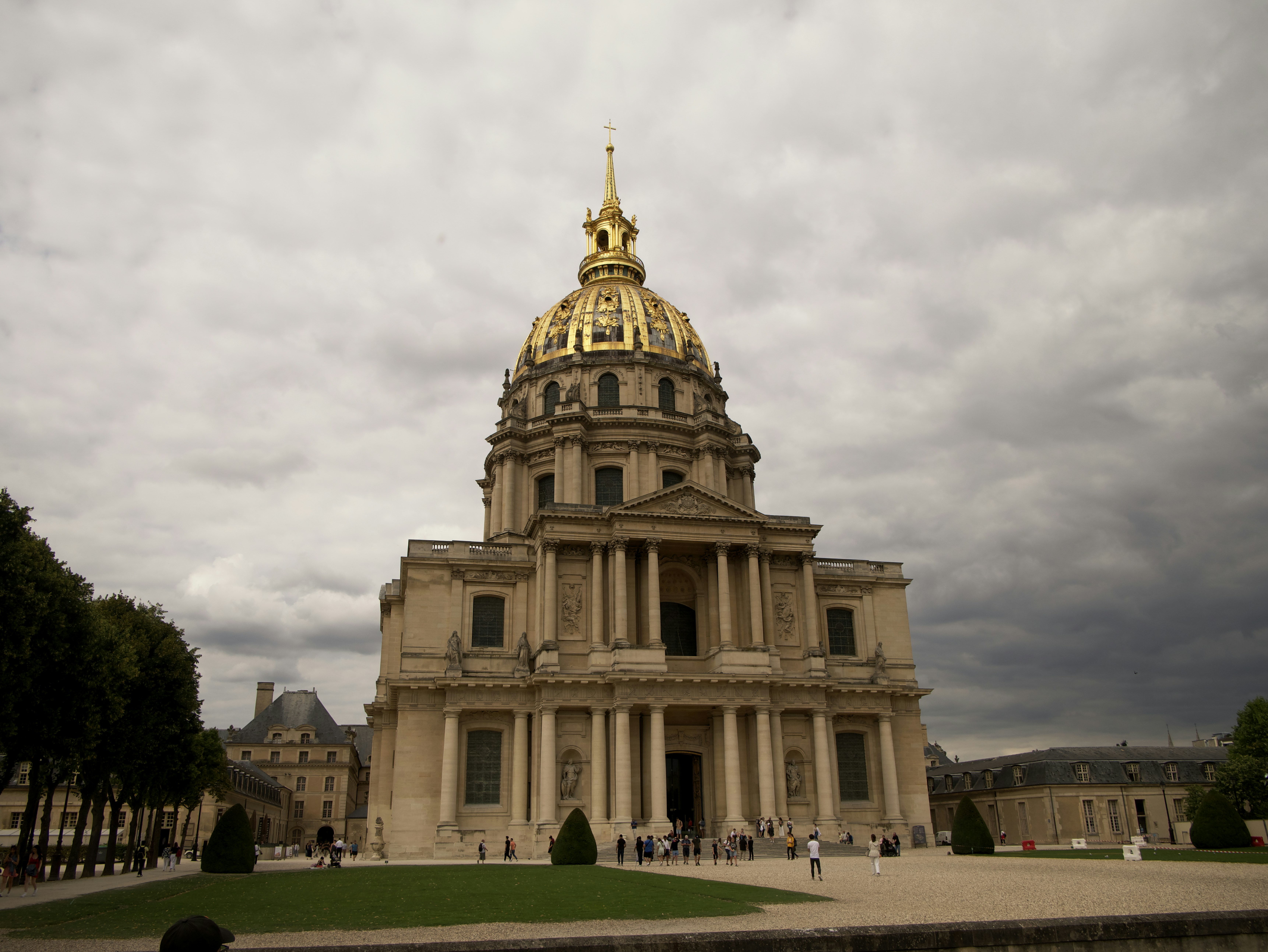 a large building with a gold domed roof and a gold dome with Les Invalides in the background