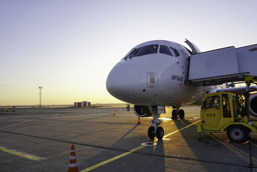 a large white airplane on the runway