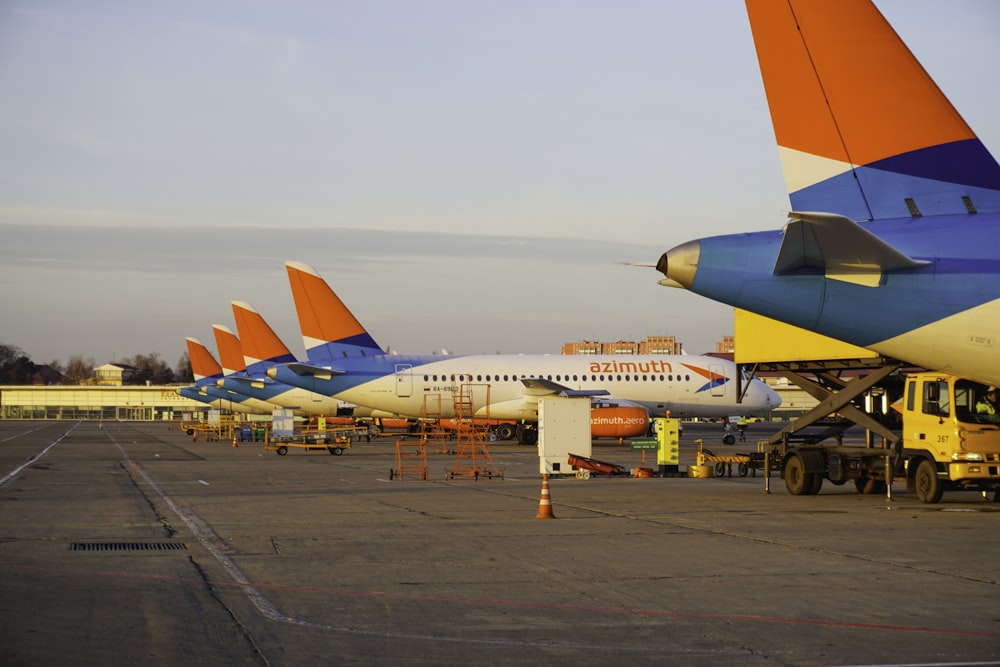 a couple of jets at an airport