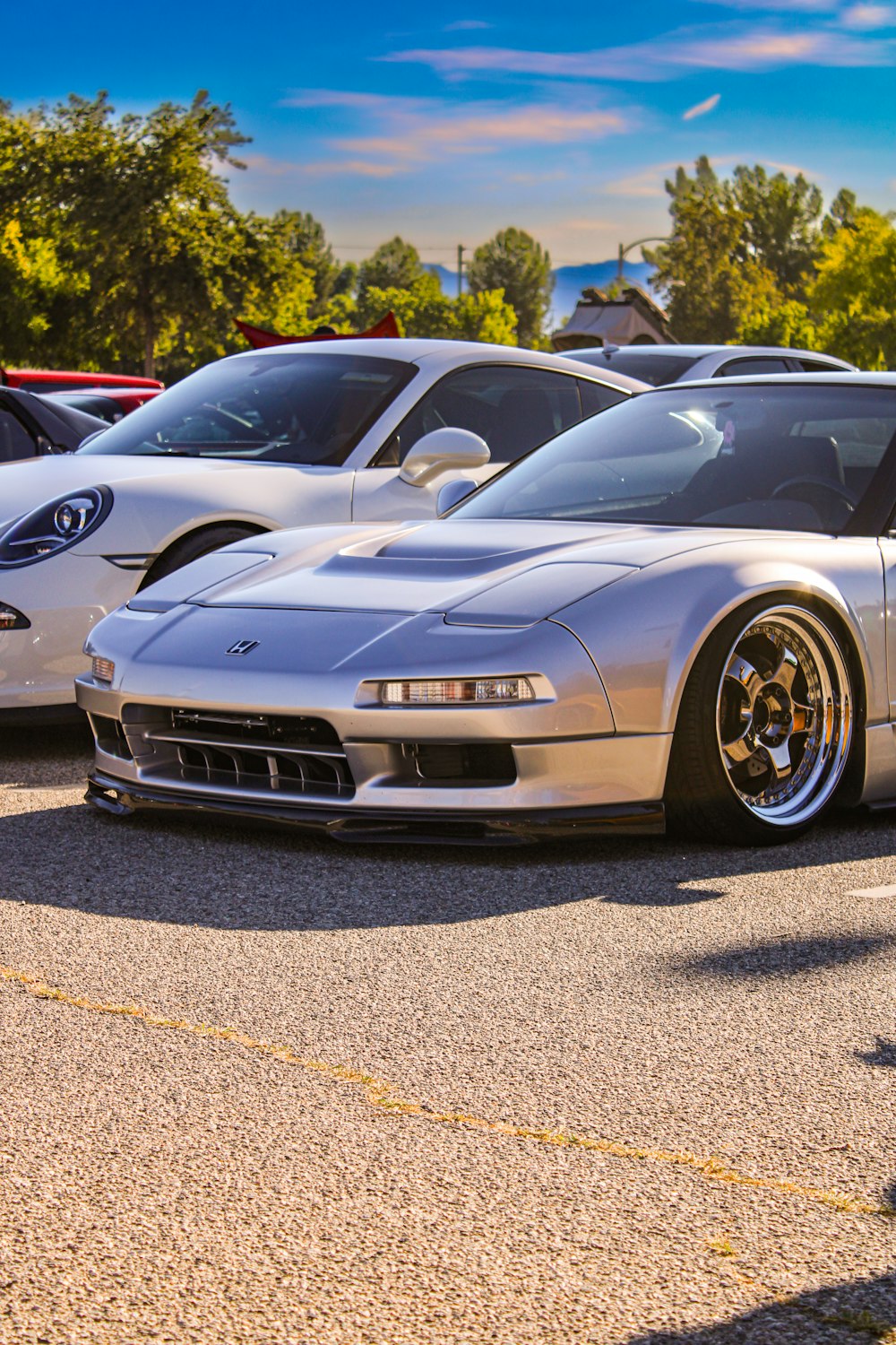 a silver car parked in a parking lot