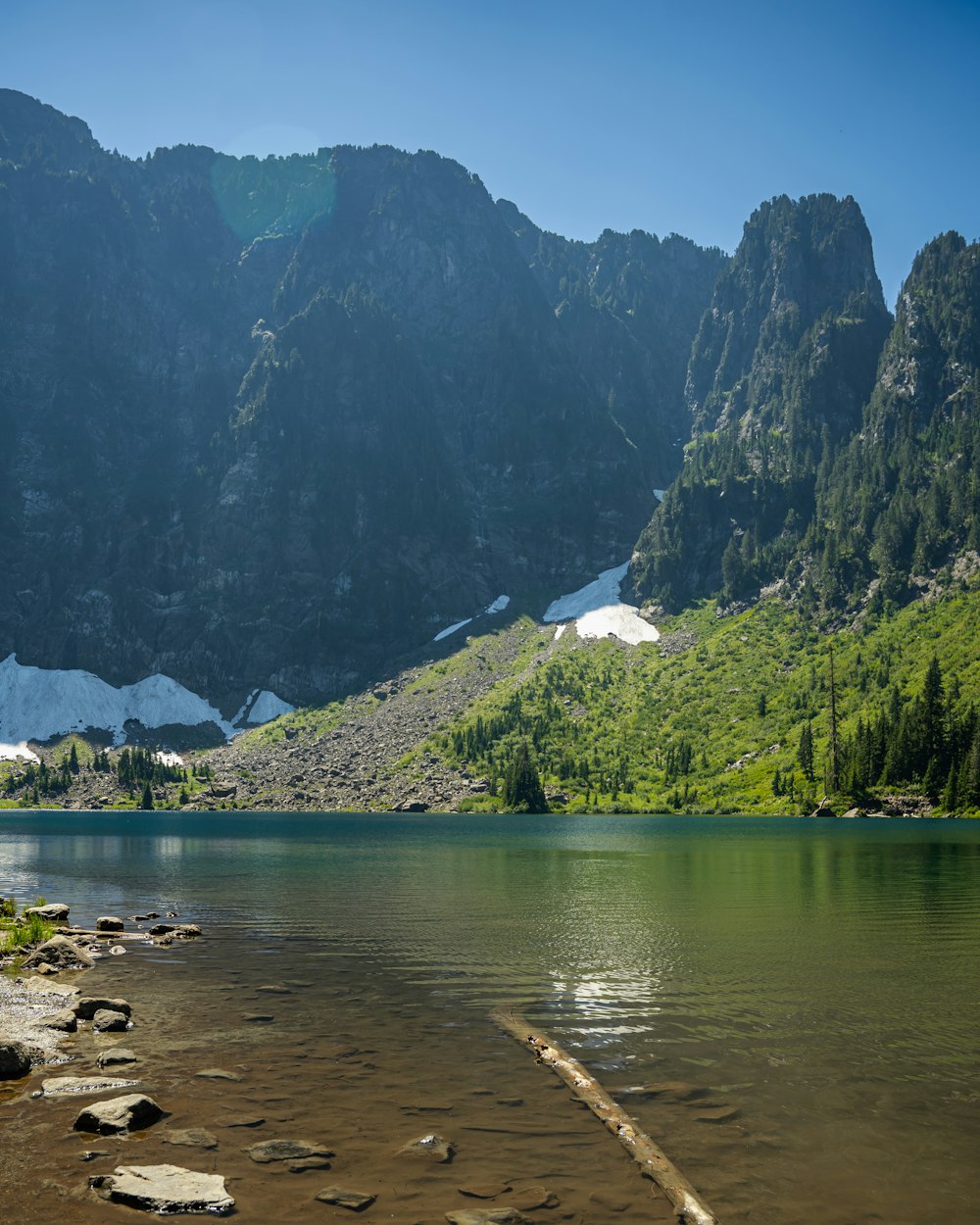 a river with mountains in the background