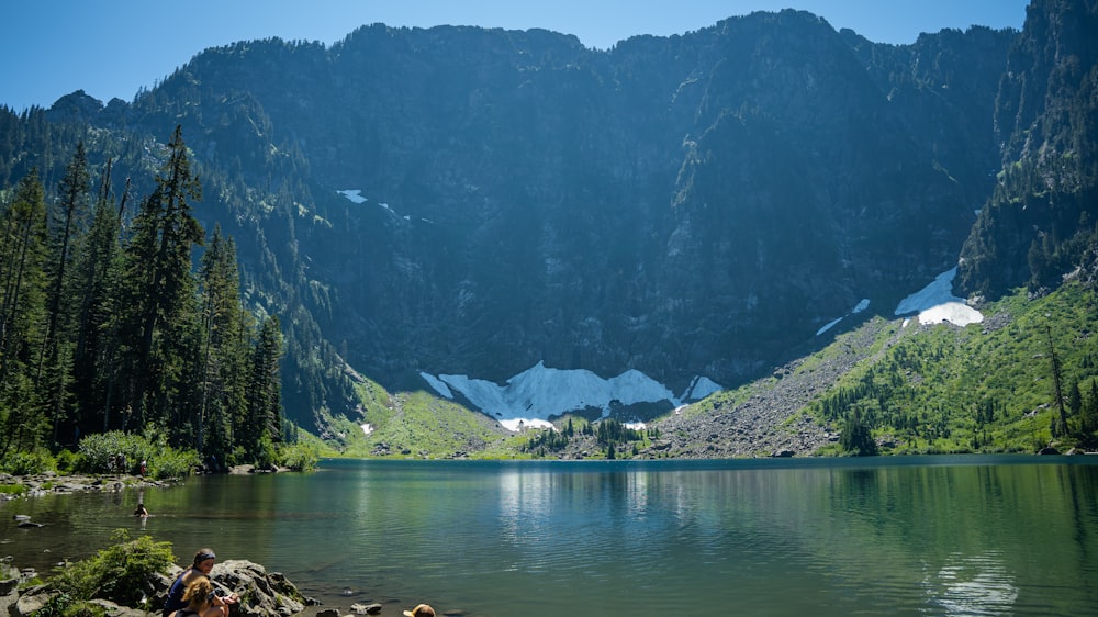 a lake with mountains in the background