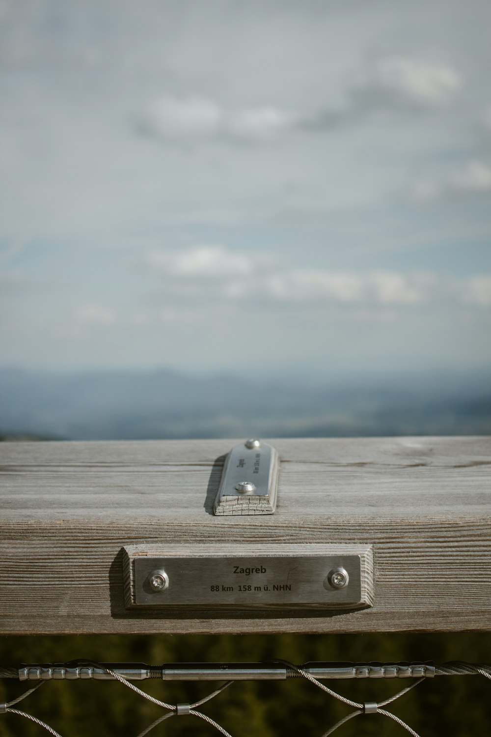 a metal box on a metal fence