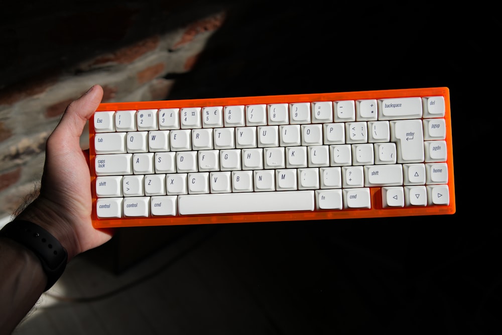 a person holding a keyboard