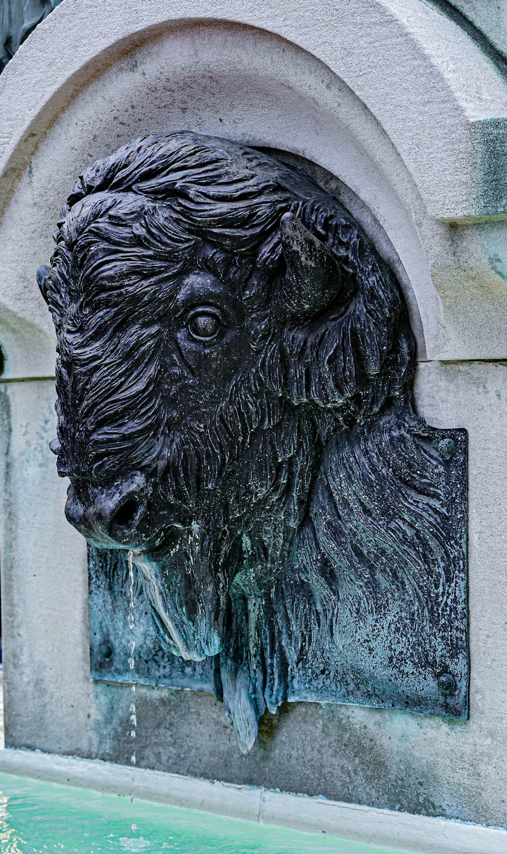 a stone sculpture of a lion