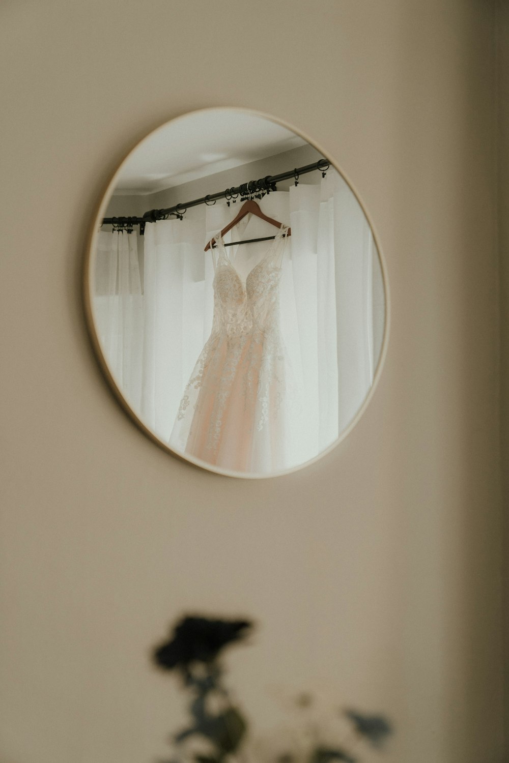 a white wall with a picture of a person in a dress