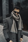 a person wearing sunglasses and a scarf