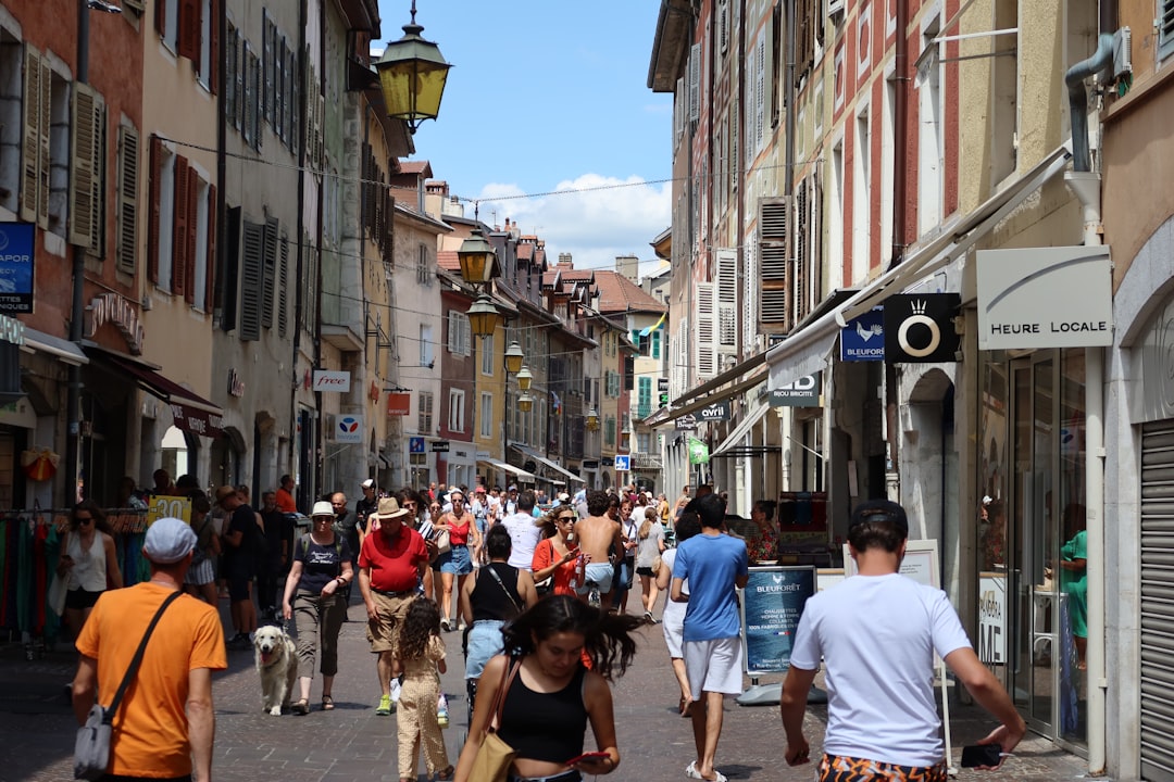 a group of people walking down a street,