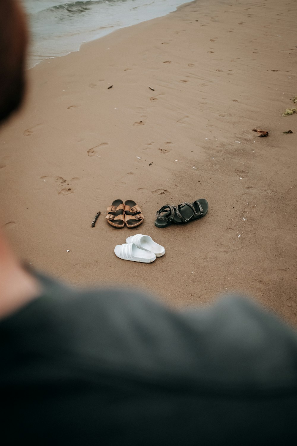 a pair of sandals on a beach