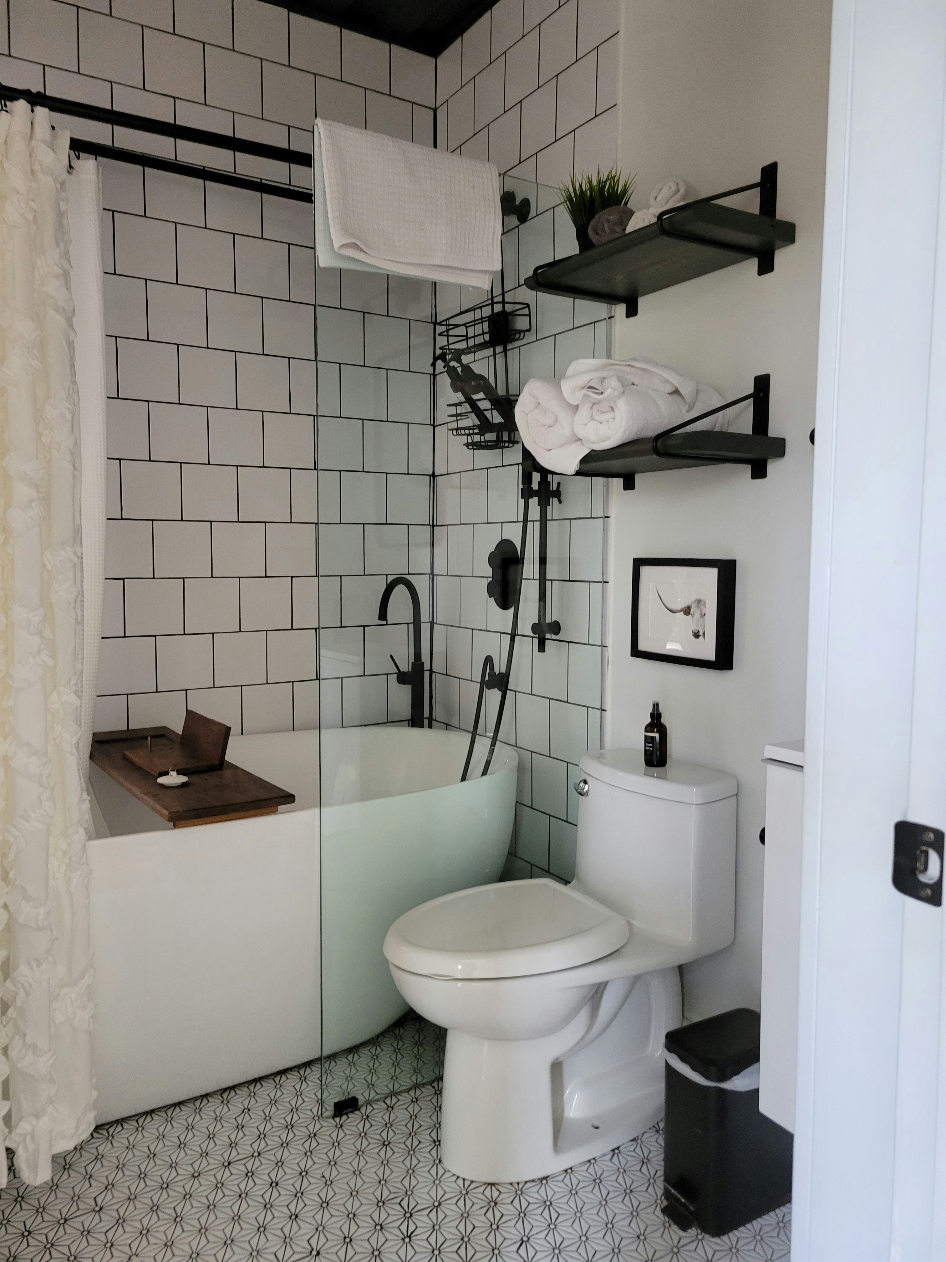 a bathroom with a toilet and bathtub