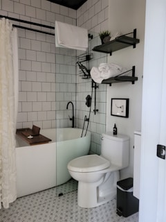 a bathroom with a toilet and bathtub