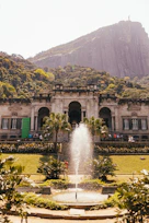 a large building with a fountain in front of it