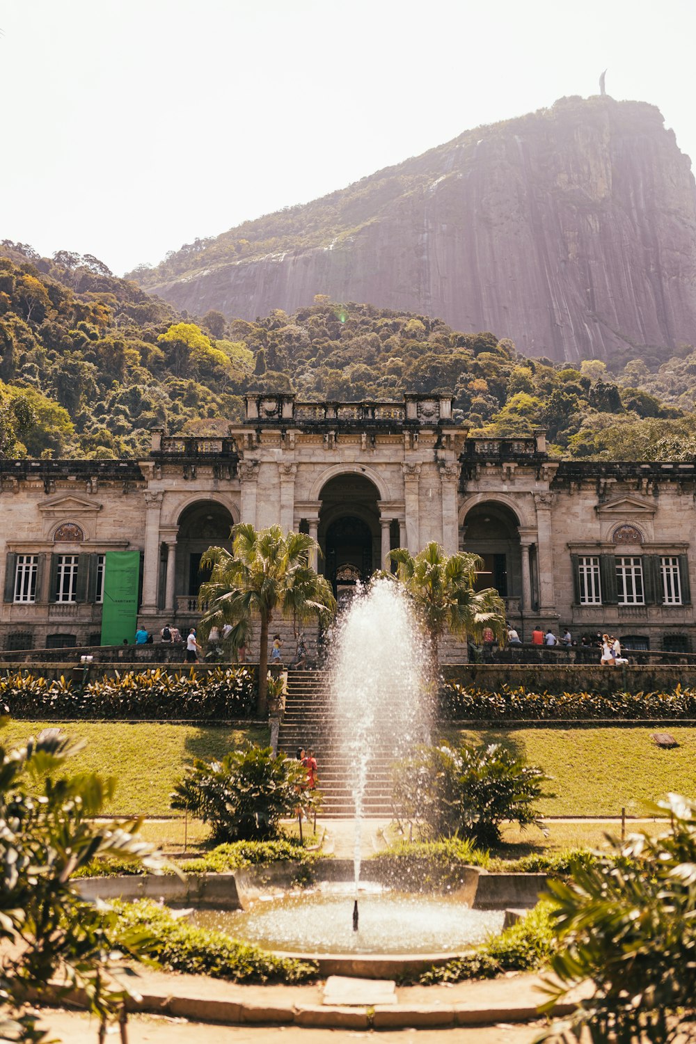 a large building with a fountain in front of it