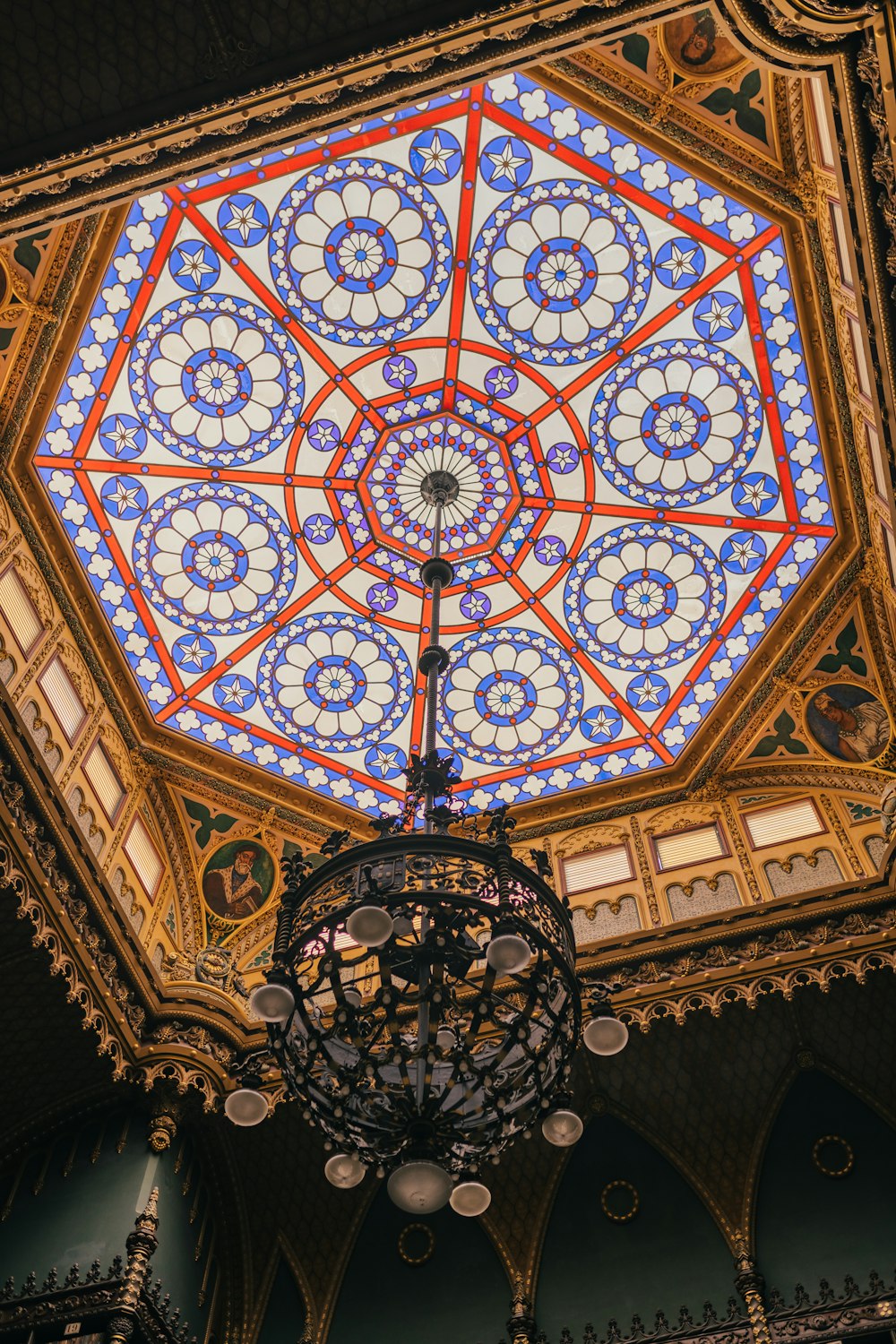 a ceiling with a chandelier and a chandelier