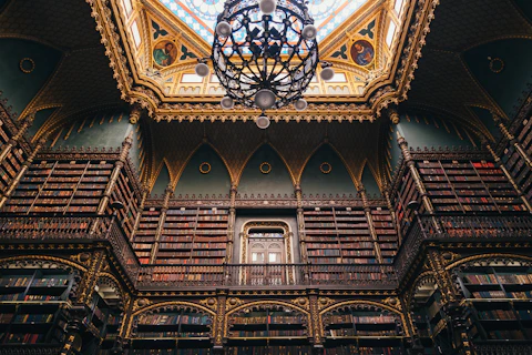 a large ornate ceiling with a stained glass window