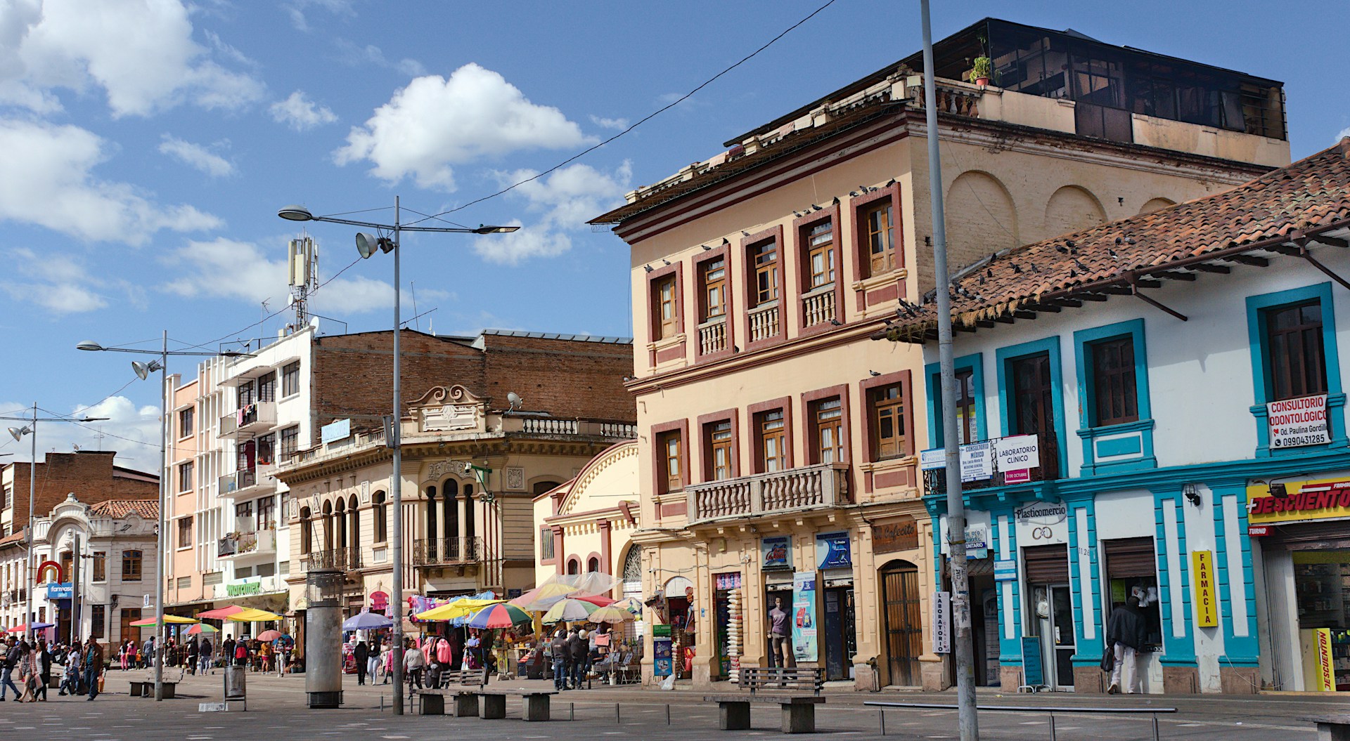 A vibrant street scene in Salvador, Bahia, capturing local culture and daily life under a bright sky.
