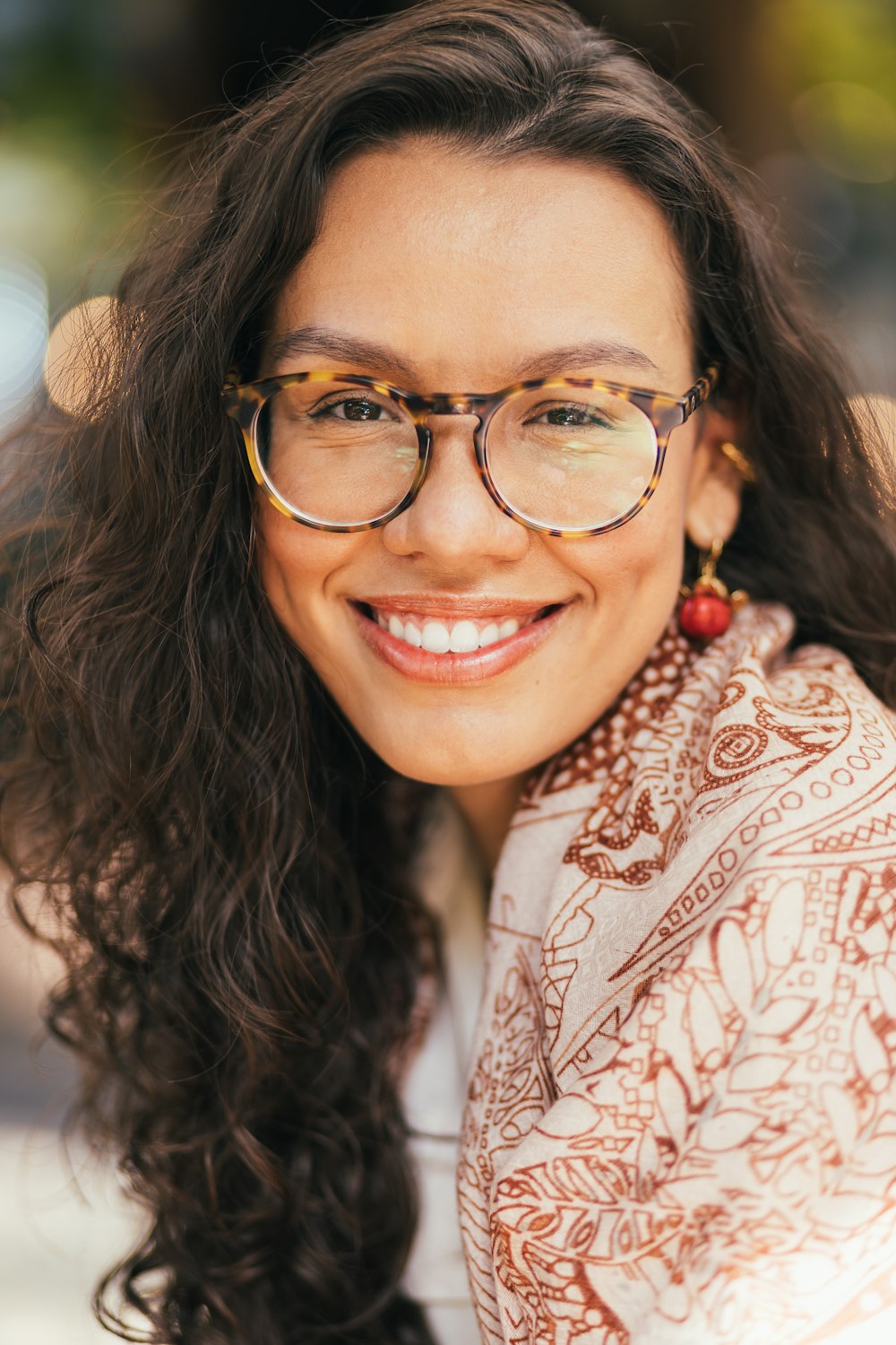 a woman with long hair and glasses