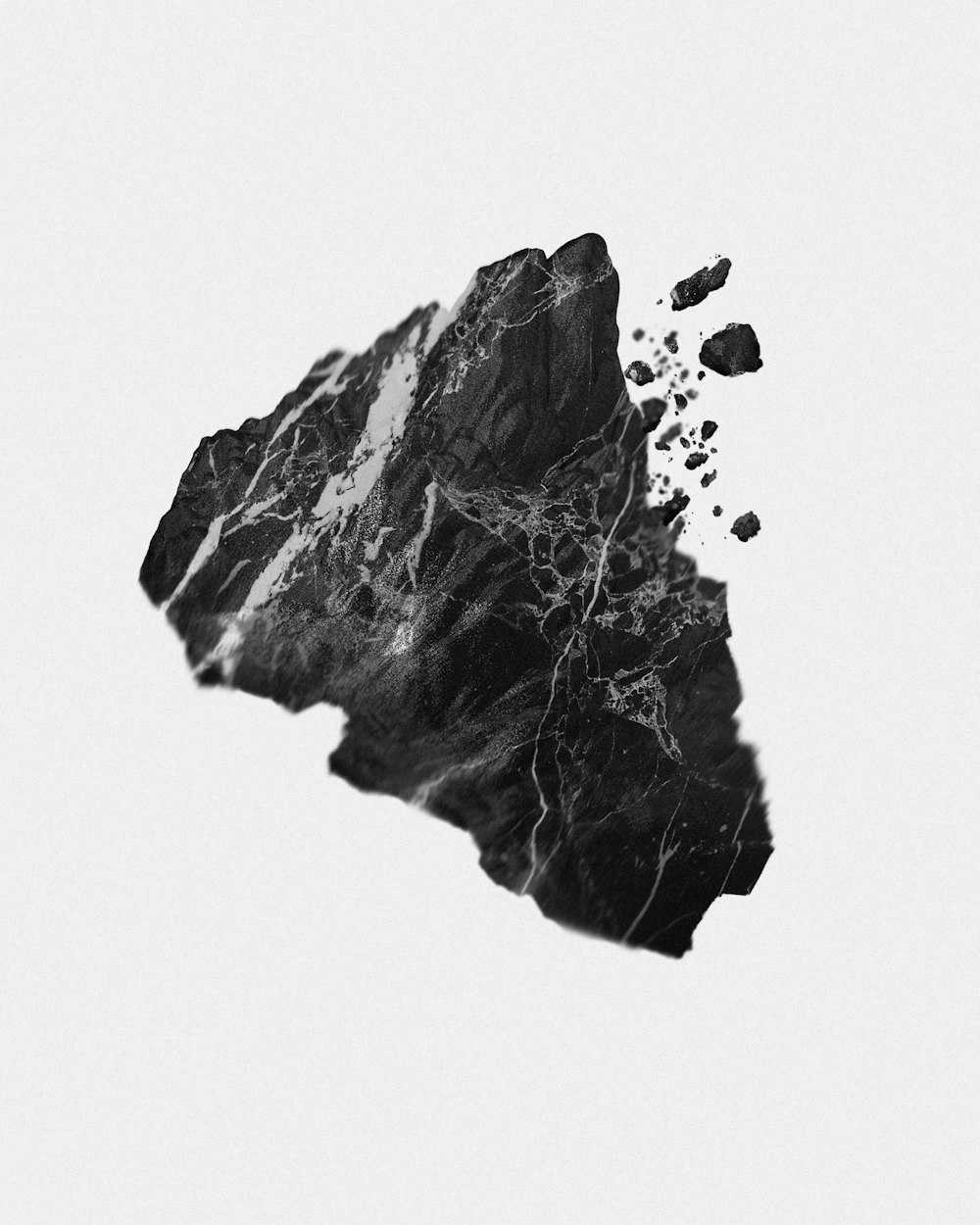 a black and white image of a rock