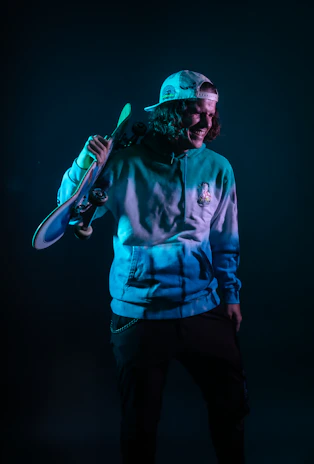 Lifestyle shot of a person skateboarding at dusk wearing a Distortions streetwear tee with a dark, moody background.