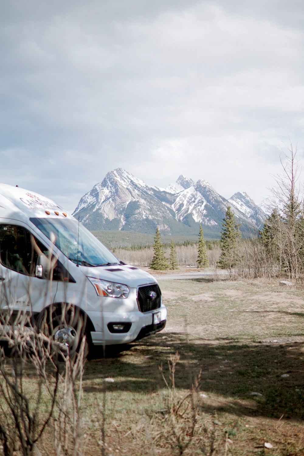 a car parked in front of a mountain