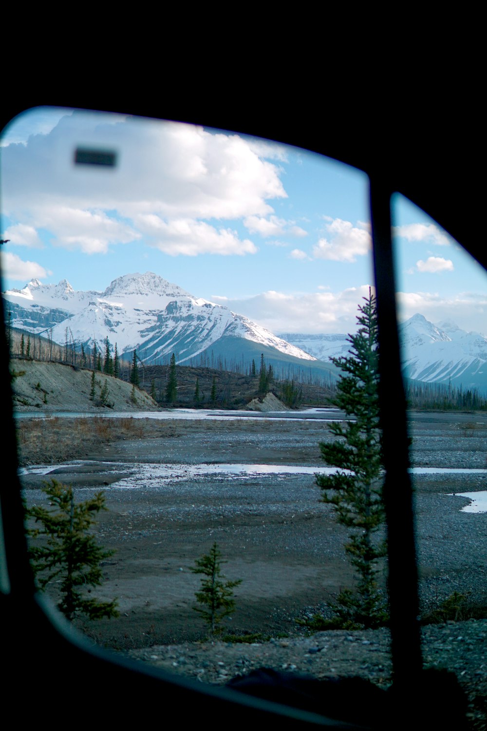 a view of a mountain range from a window