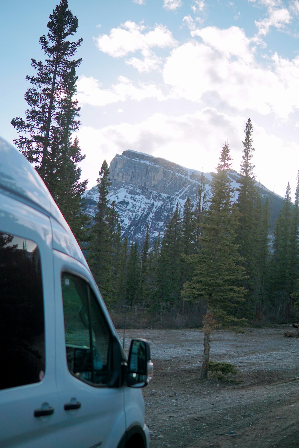 a car parked in front of a mountain