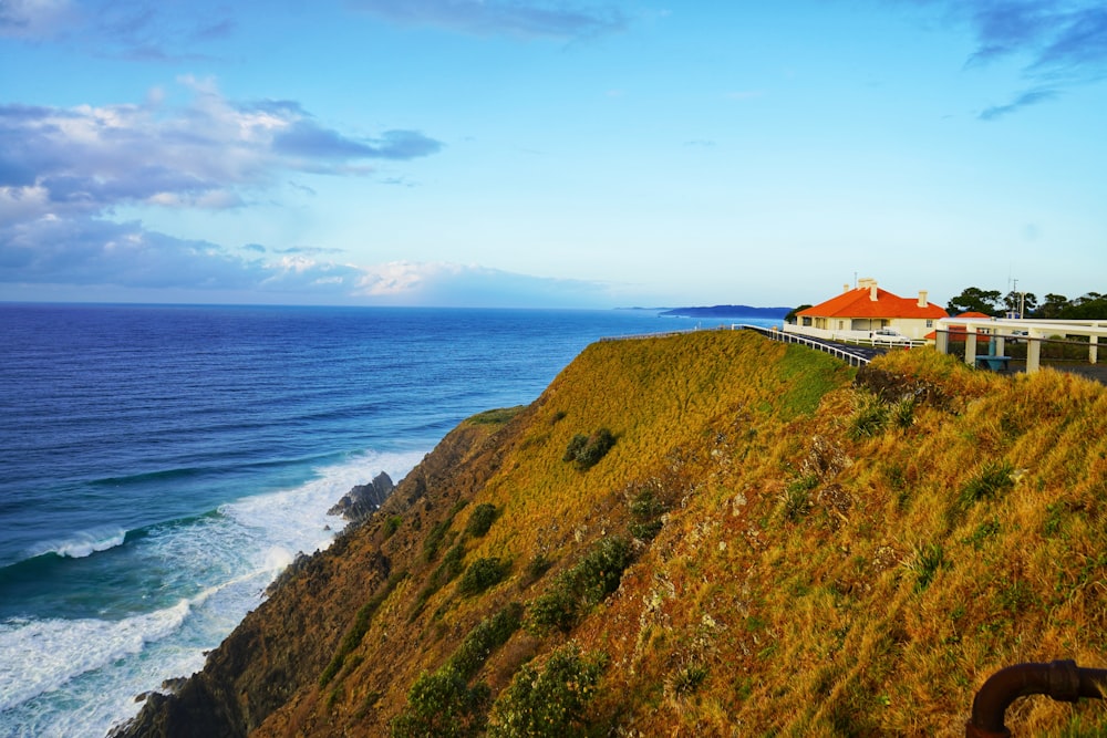 a building on a hill by the ocean