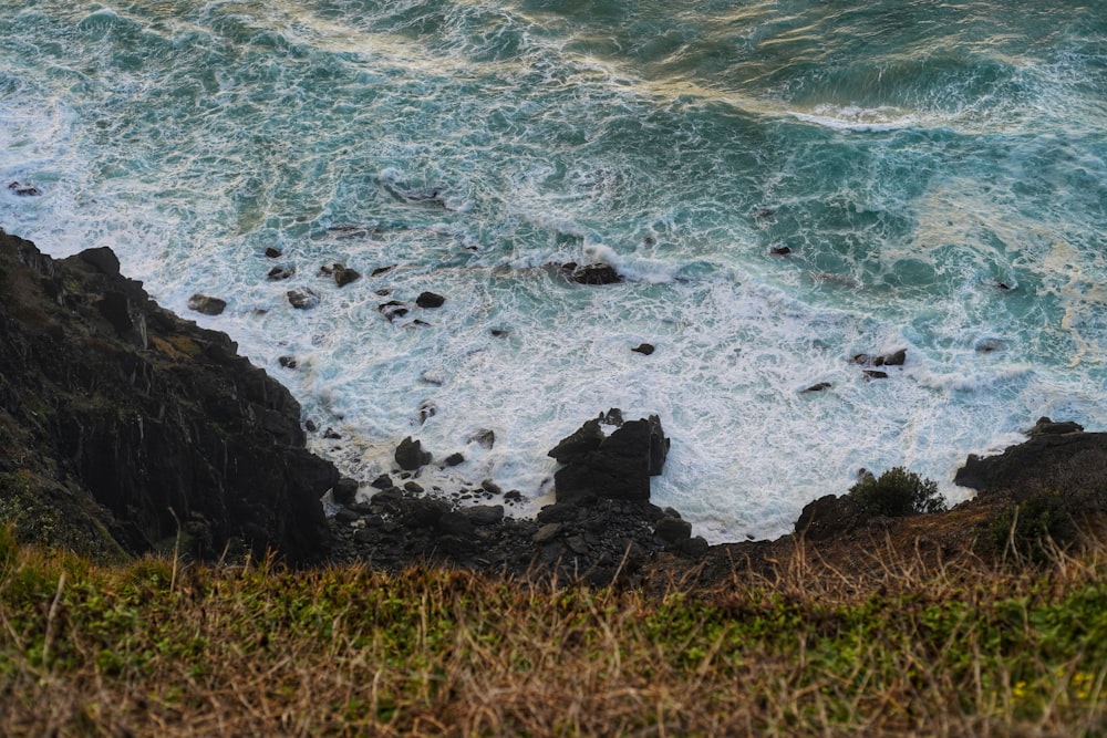 a rocky beach with waves crashing