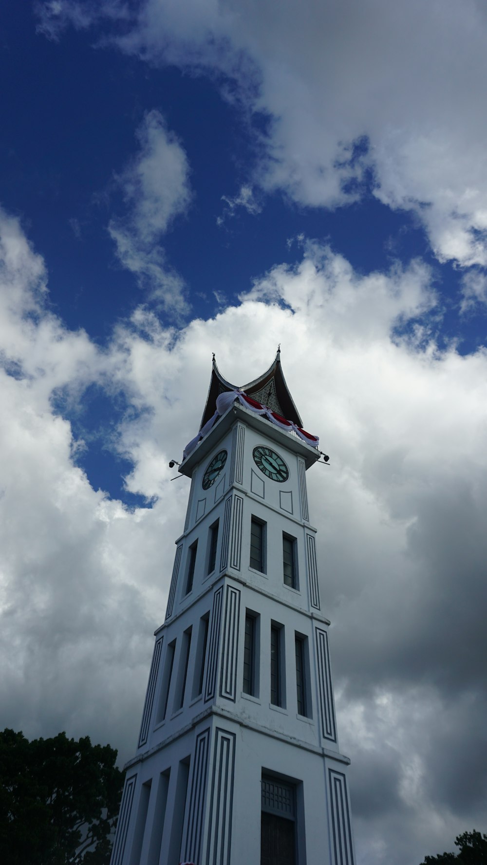 a clock tower with a flag on top