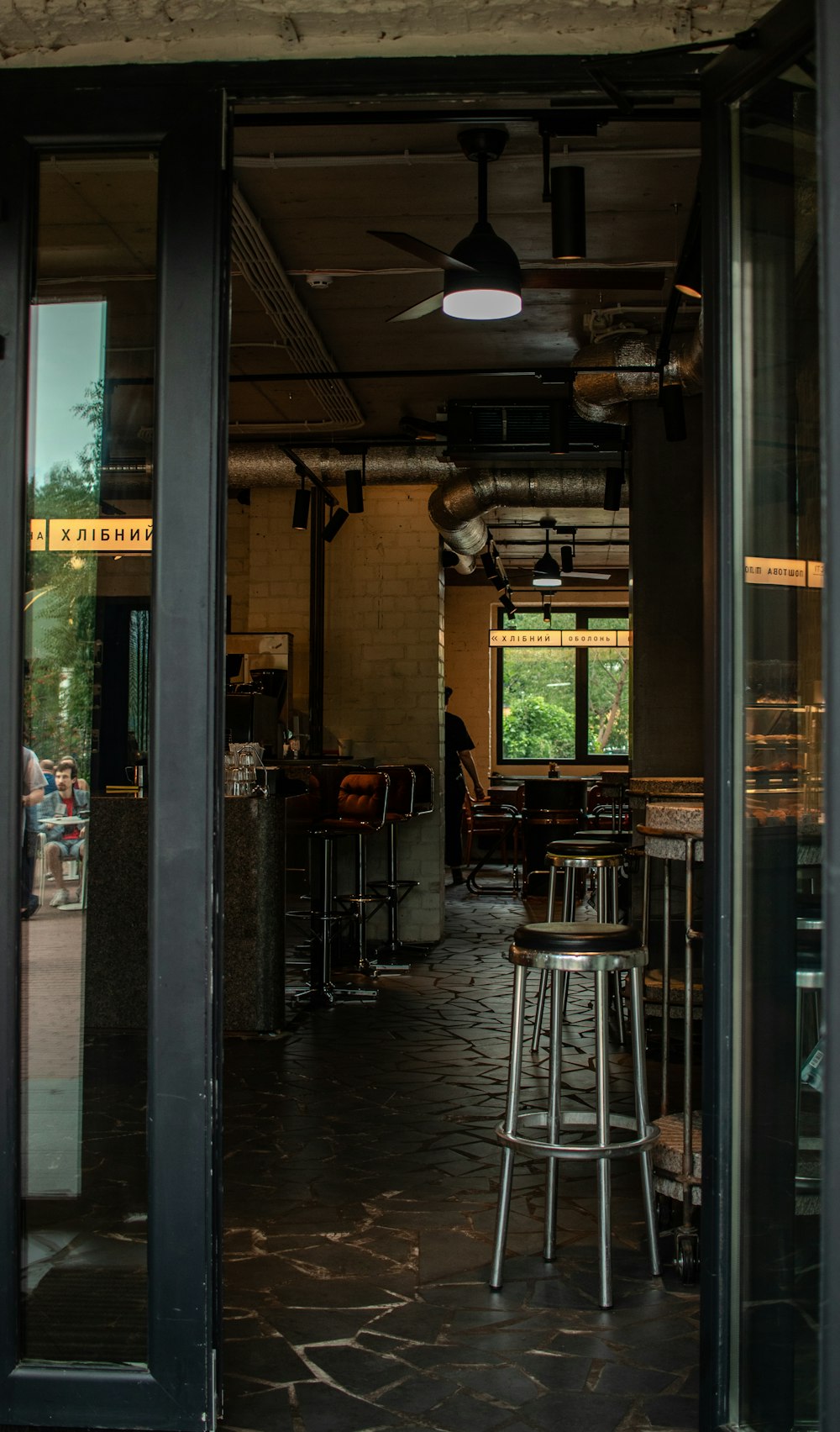 a room with stools and tables