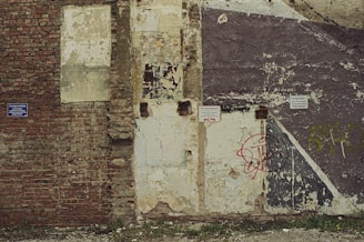 a brick wall with graffiti on it