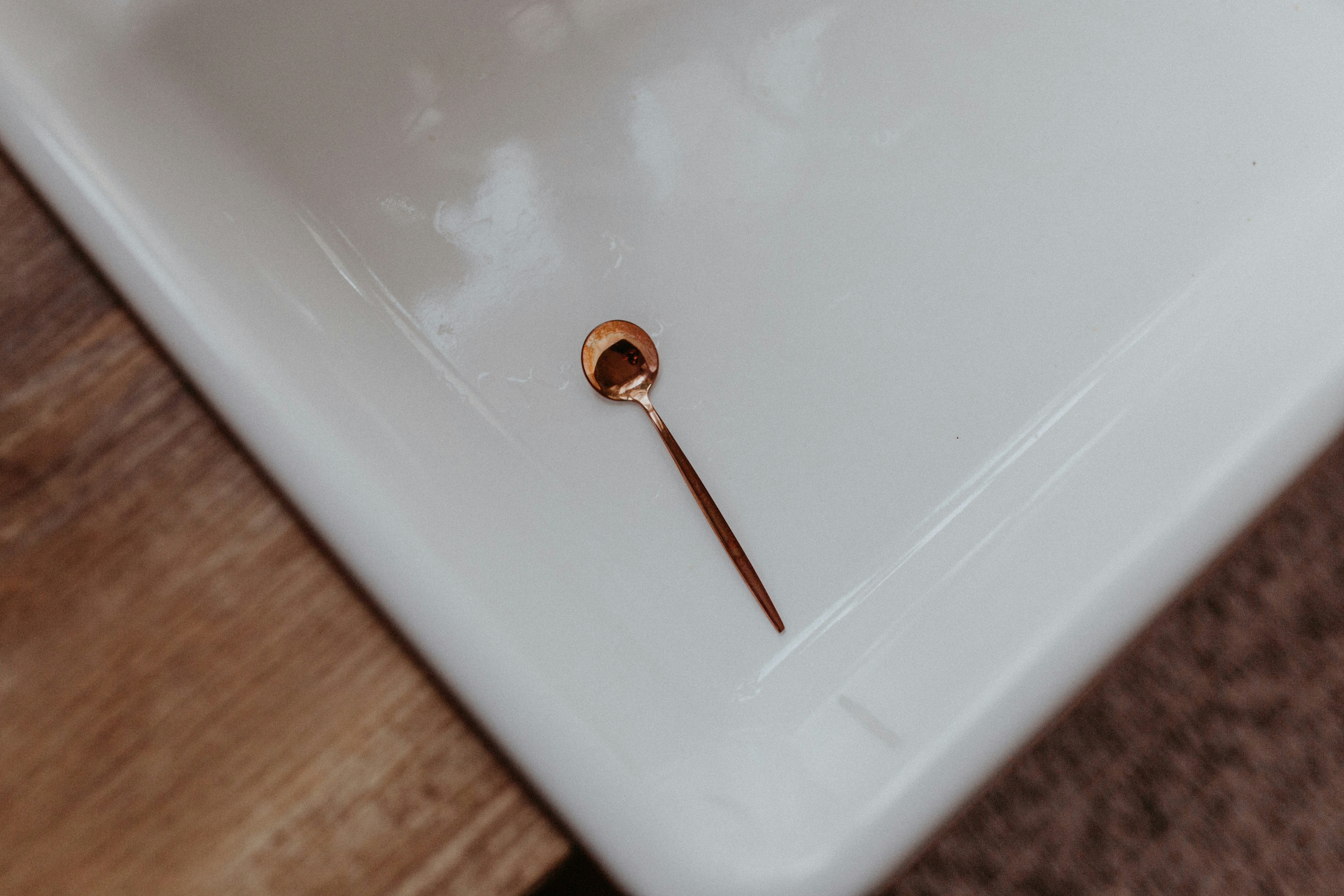 a small metal object on a white surface