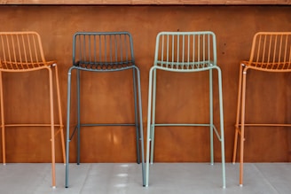 Customized bar stools showcasing different fabrics and colors.