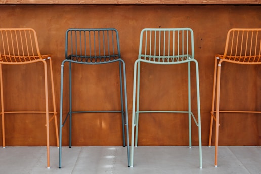 Customized bar stools showcasing different fabrics and colors.