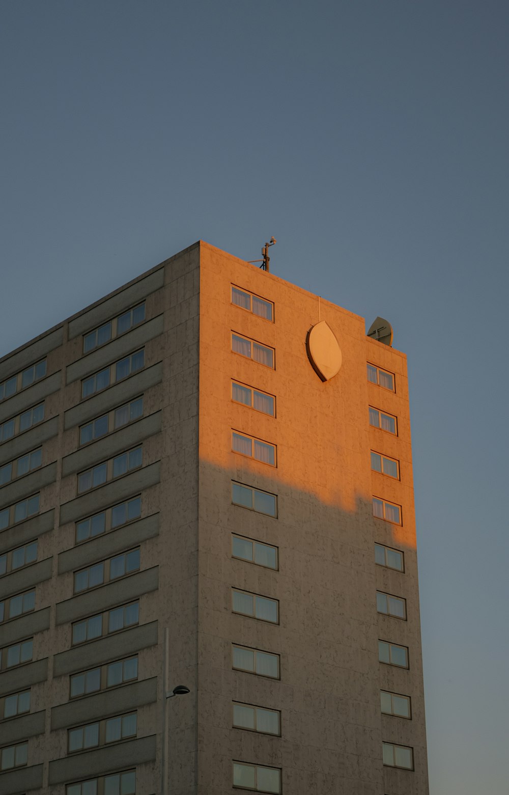 a tall building with a round window