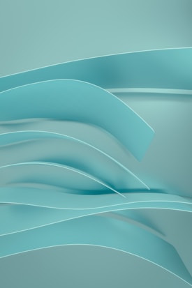 Curved, overlapping strips in a smooth, flowing arrangement create an abstract, three-dimensional design. The surface has a soft, matte finish, contributing to a serene and minimalist aesthetic.