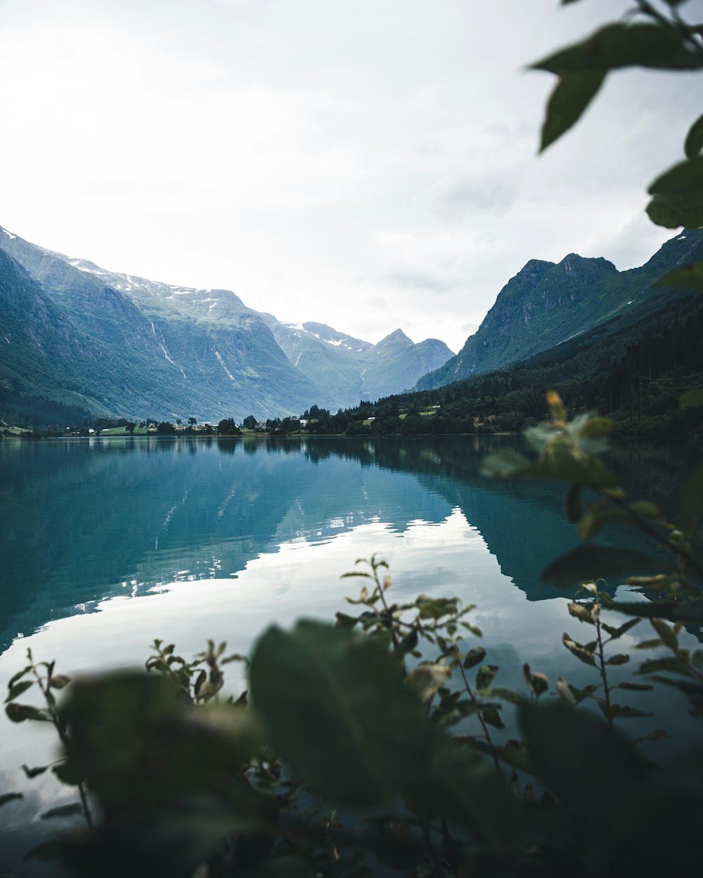 a lake with mountains in the background