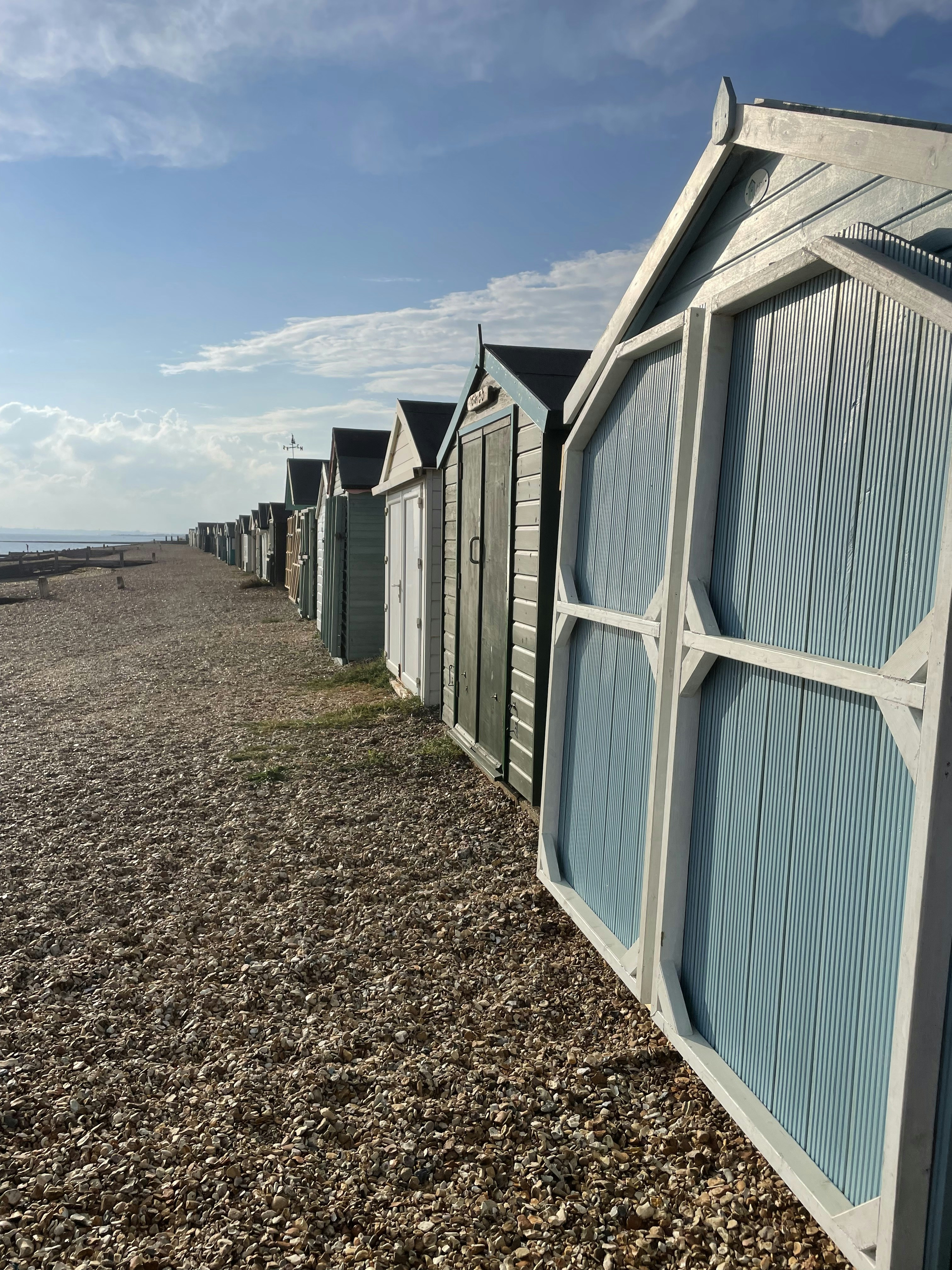 row of sheds on a beach