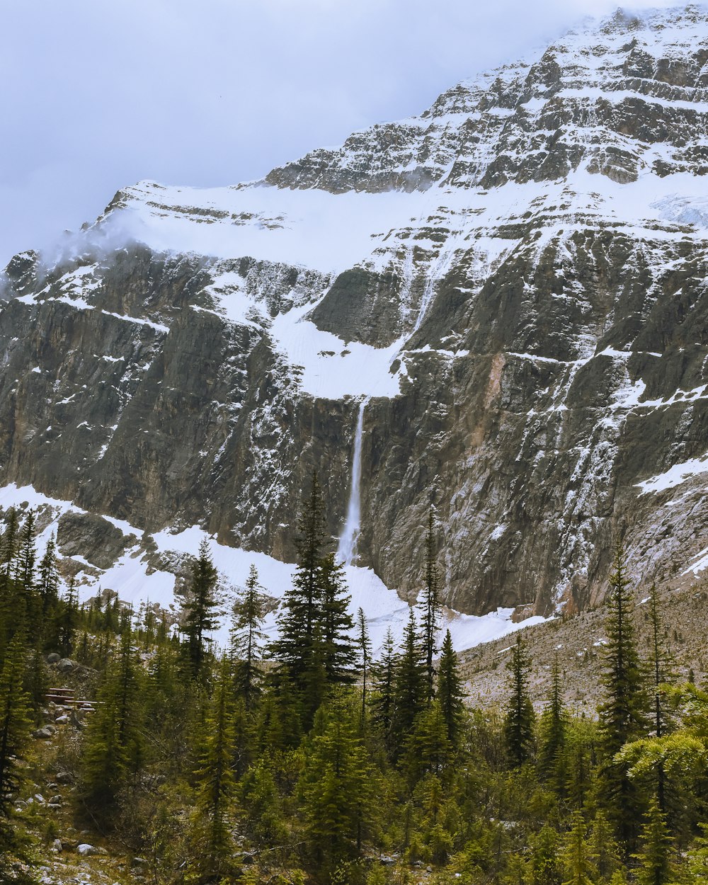 a waterfall in a snowy mountain