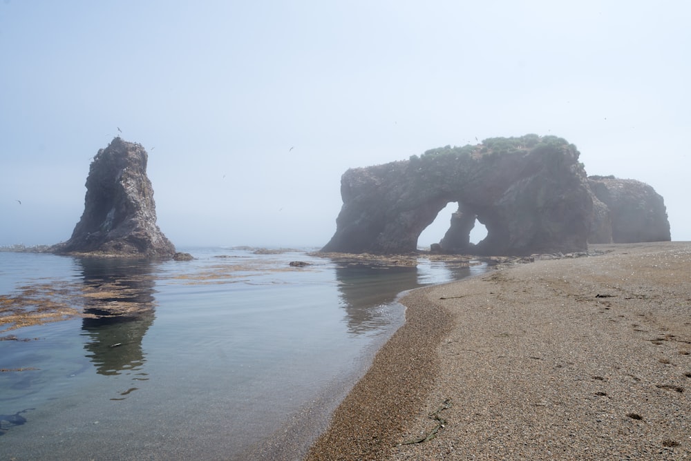 a beach with large rocks