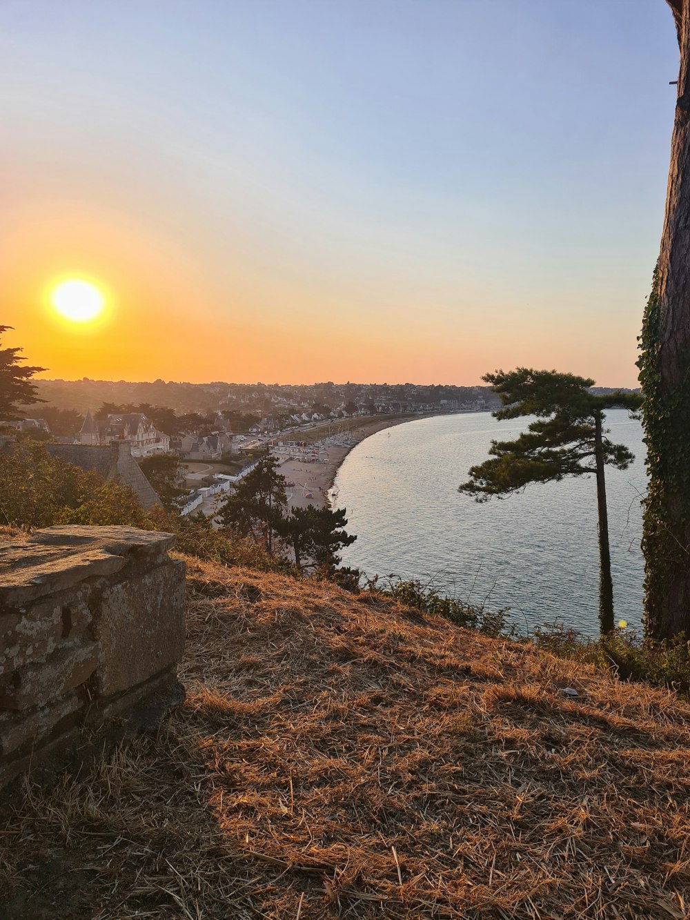 a river with a sunset