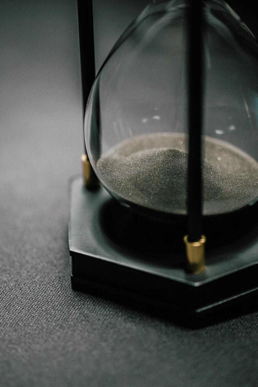 A brass-and-glass hourglass timed to run for exactly sixty minutes
