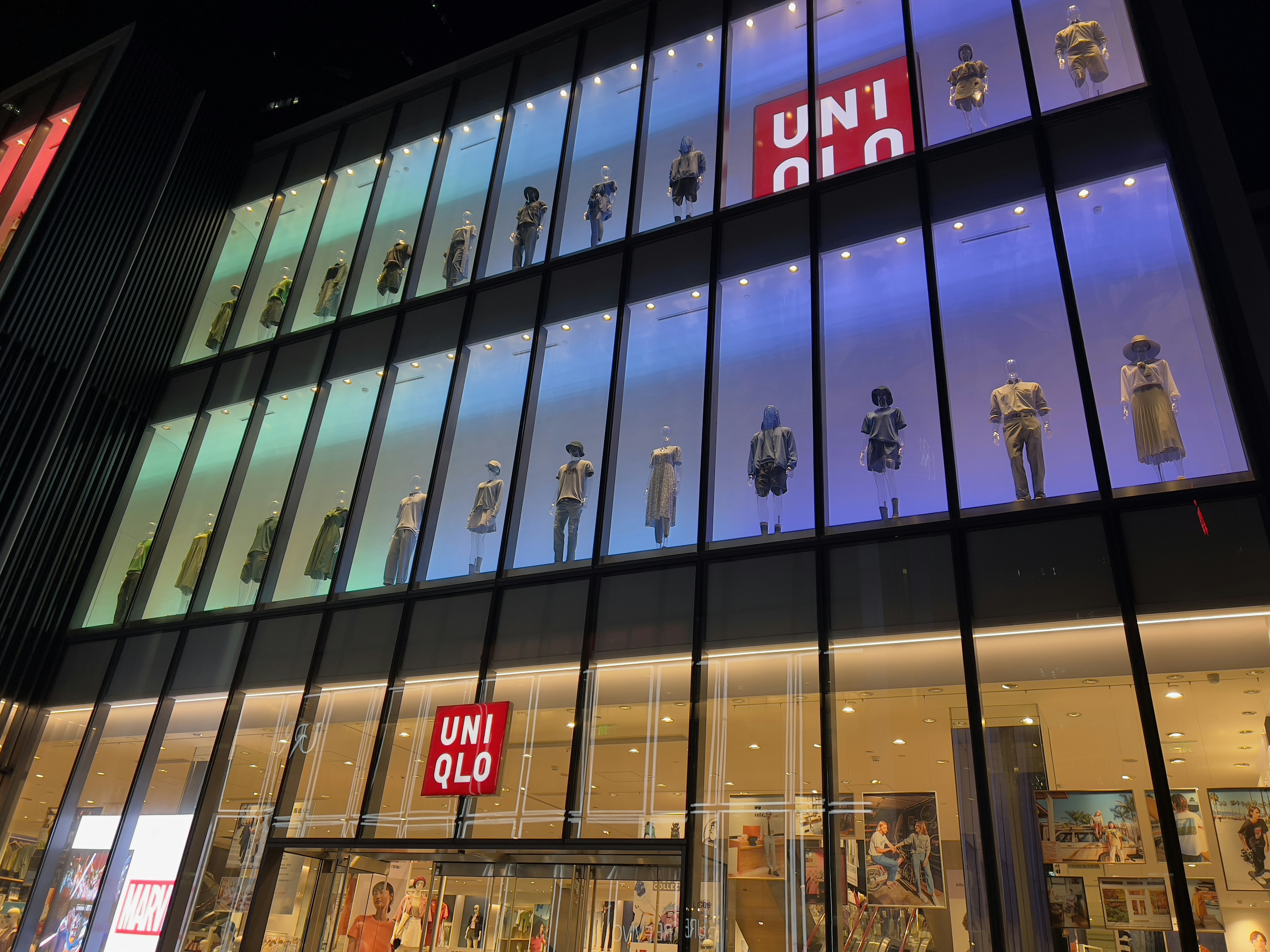 a building with many windows and signs on the windows