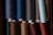 Spools of polypropylene bag closing threads lined up in a bright factory setting.