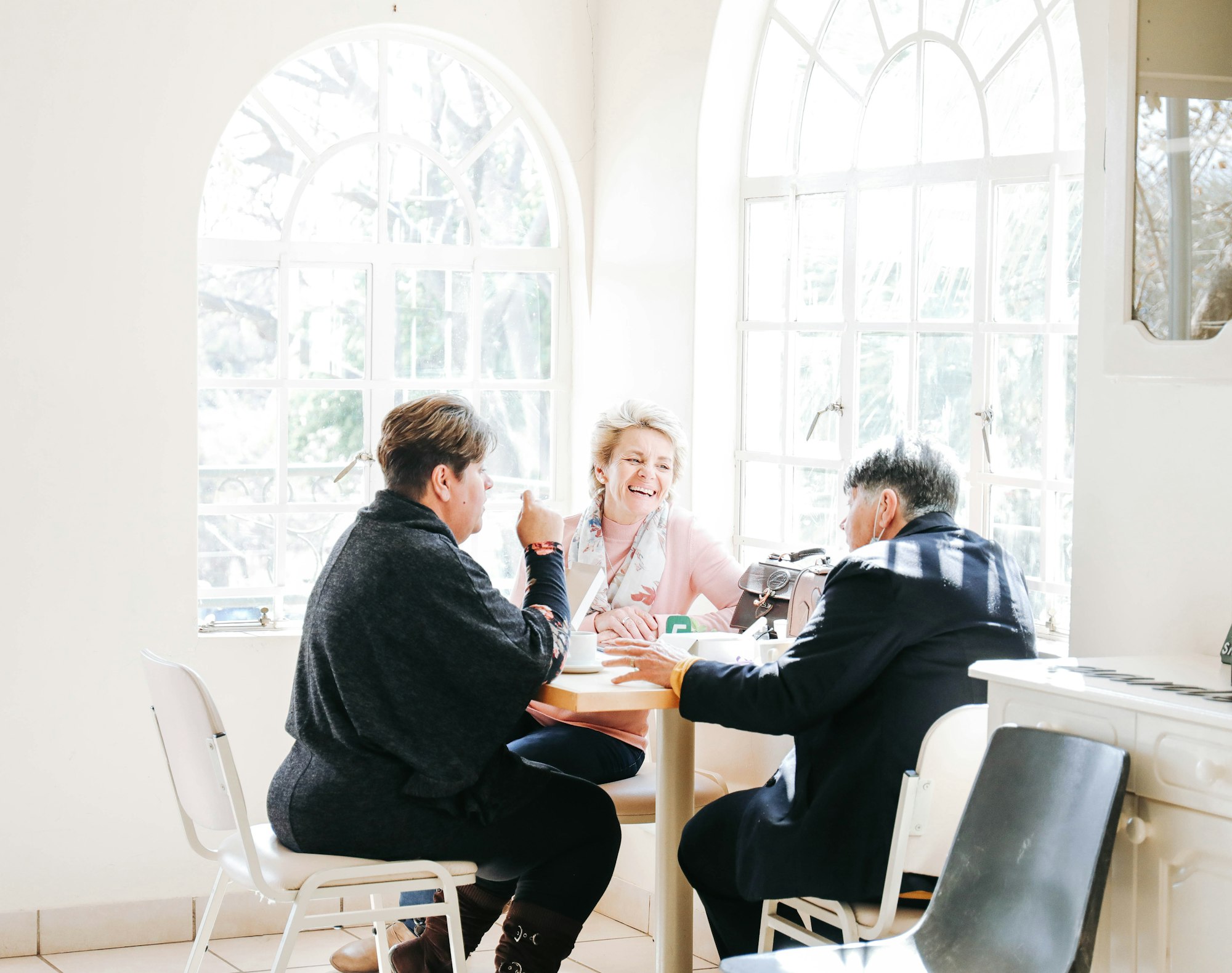 a group of people sitting around a table