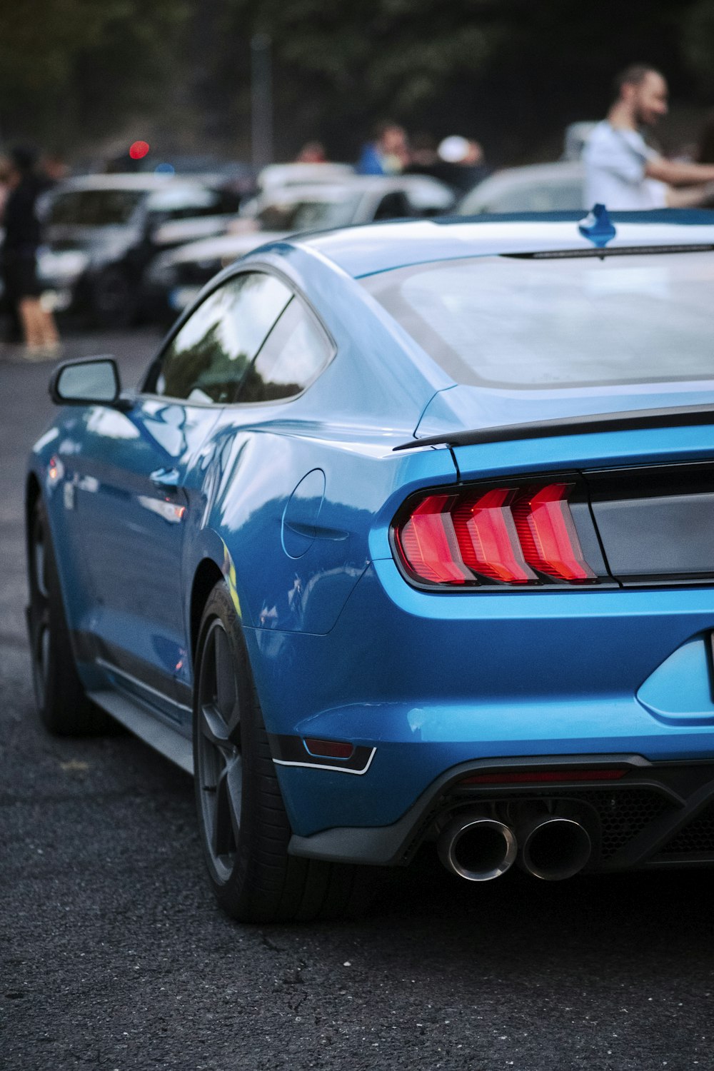 a blue car on a road