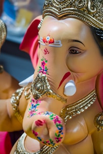 A finely detailed 3D printed statue of Lord Ganesha, showcasing intricate patterns and vibrant colors.