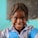 A smiling child receiving educational support from the charity.